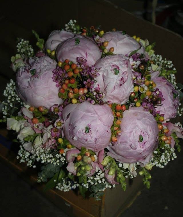 Blush pink peony bridal bouquet with berries, wax flower and white filler
