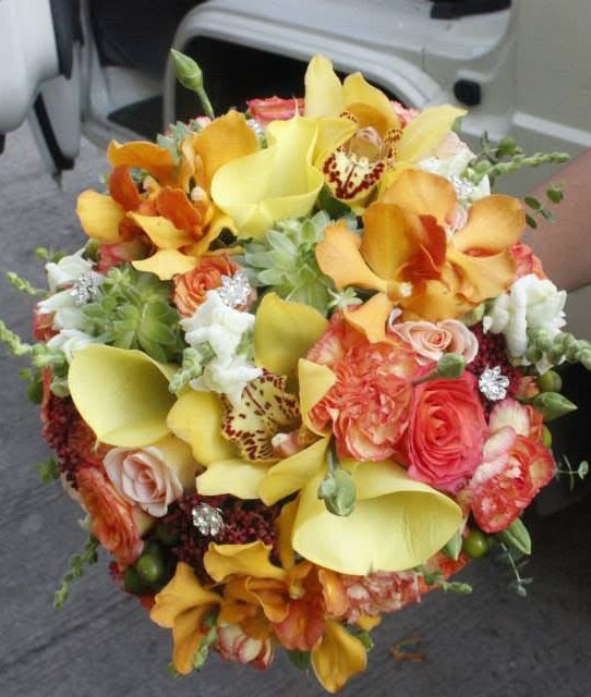 Yellow and orange orchid bridal bouquet with roses, carnations and succulents