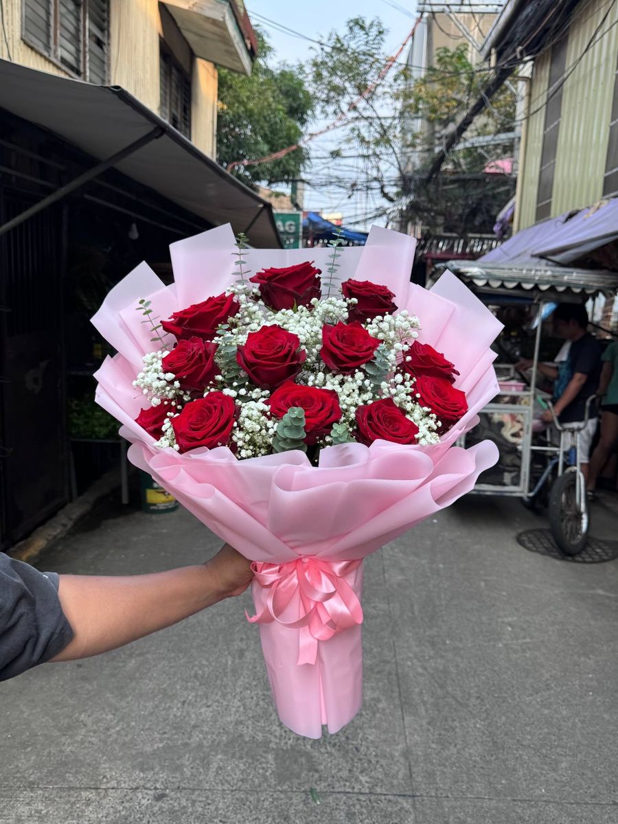 Red Ecuadorian rose bouquet with baby's breath, eucalyptus and pink wrap