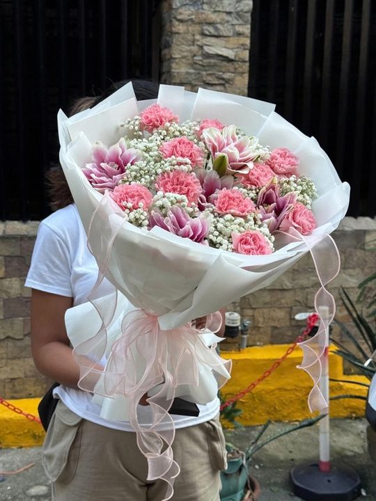 Pink carnation and lily bouquet with baby's breath
