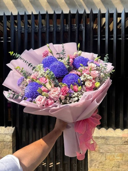 Sunshine and lisianthus bouquet with blue mums and eucalyptus