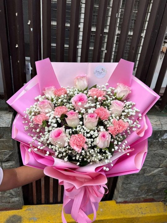 Pink rose and carnation bouquet with baby's breath