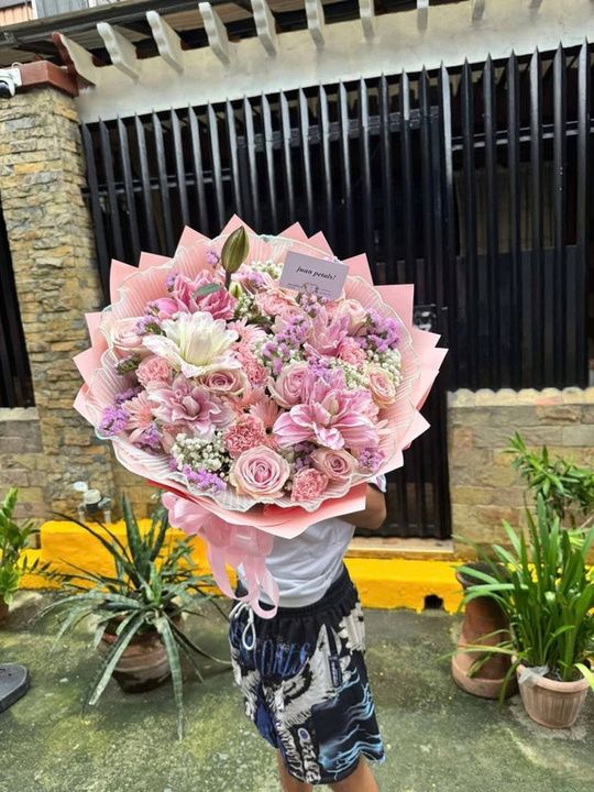 Pink garden bouquet with roses, lilies, gerbera and carnations