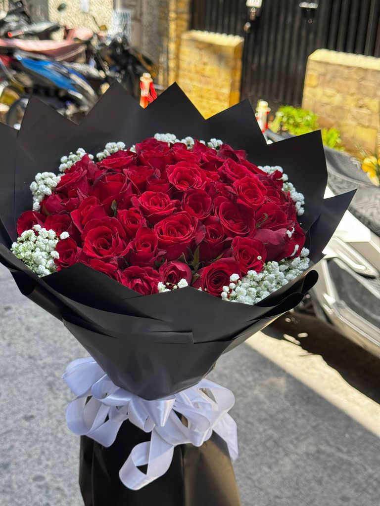 Roses arranged in black wrapping