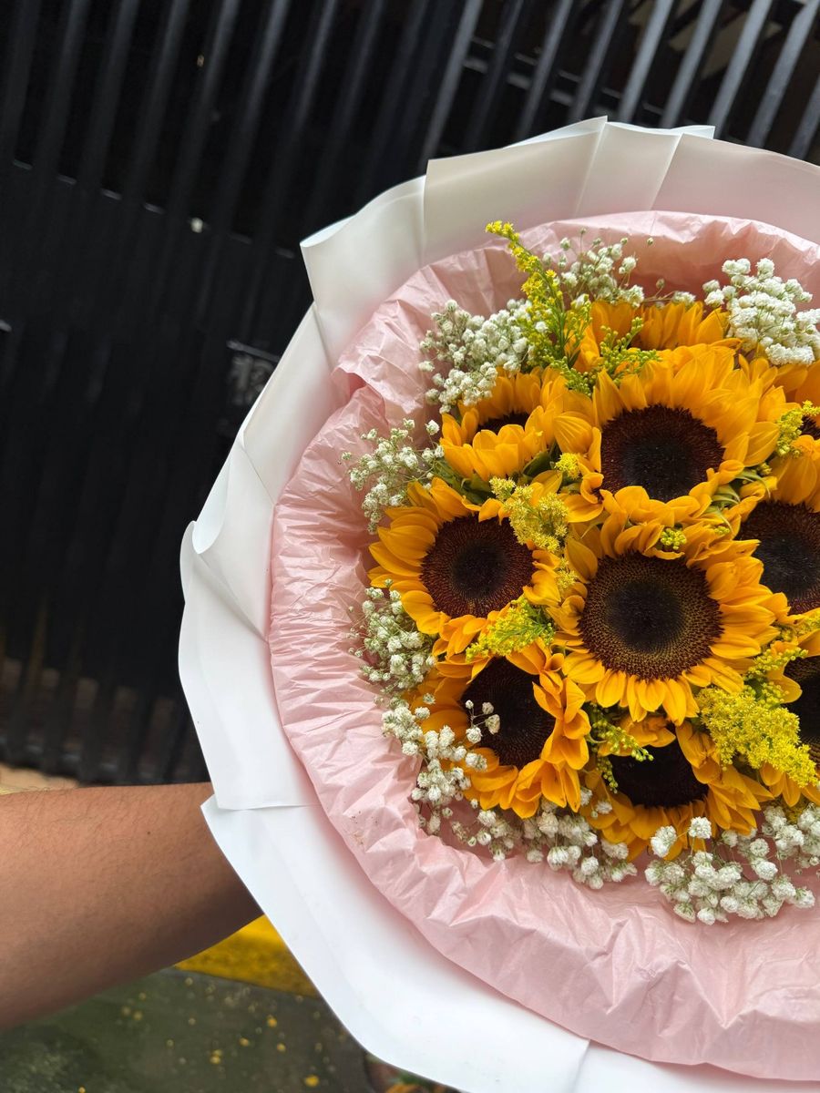 Sunflower bouquet with baby's breath and yellow accents